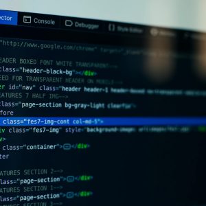 Detailed view of HTML code on a computer screen, ideal for tech and software development themes.